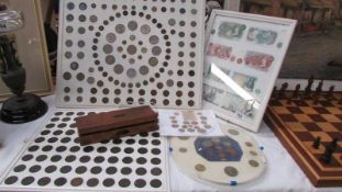 A collection of coin and bank note displays and other coins. COLLECT ONLY.