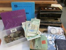 A mixed lot of coins, bank notes, two cash tins etc.,