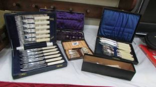 A mixed lot of cased cutlery sets etc.,