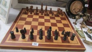 A chess set with board. COLLECT ONLY.