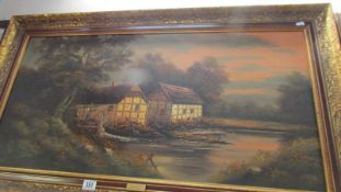 A large framed oil on canvas water mill scene. COLLECT ONLY.
