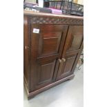 An oak cabinet with lift up top, COLLECT ONLY.