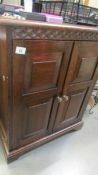 An oak cabinet with lift up top, COLLECT ONLY.