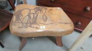 A rustic stool depicting horses, COLLECT ONLY.