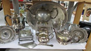 A mixed lot of silver plate including tea set, tray etc.,