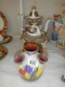 Two teapots and a crocus vase.
