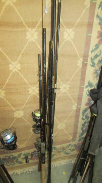 A quantity of fishing rods and two fishing reels. COLLECT ONLY.