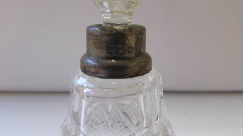 A glass perfume bottle with silver collar and original stopper. - Image 3 of 3