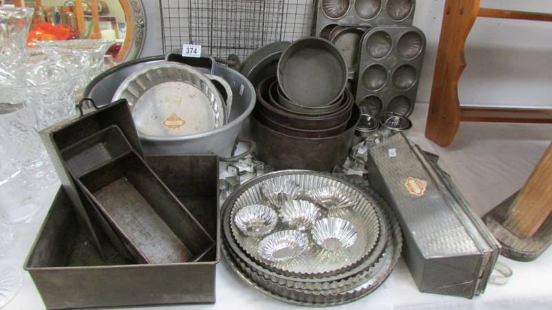 A good lot of vintage baking trays etc., COLLECT ONLY.