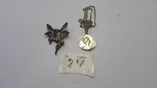 A late 20C French lady pendant on chain marked 800 and a fairy brooch.