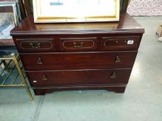 A Merridew dark wood three drawer chest of drawers. 87cm x 43cm x Height 66cm. COLLECT ONLY.