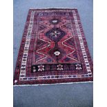 A Middle Eastern Aztec style patterned run. Length 265cm x 177cm. COLLECT ONLY.