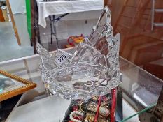 A heavy cut glass stand.