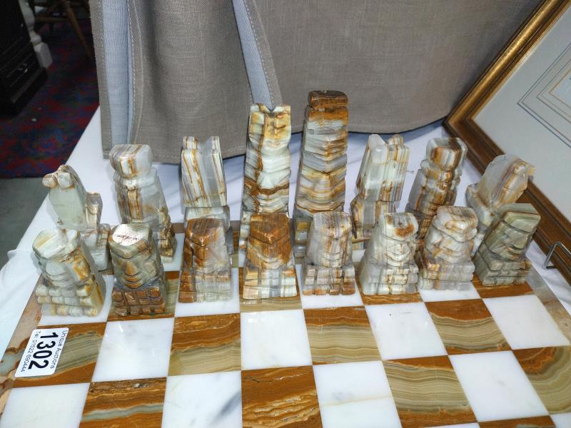 A polished stone chess set. COLLECT ONLY. - Image 2 of 3