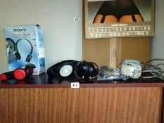 Five pairs of headphones including one set of noise cancelling pair.