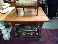 A 1930's oak drop leaf table with barley twist cross stretcher base. 91.5 x 91.5cm x height 76cm.