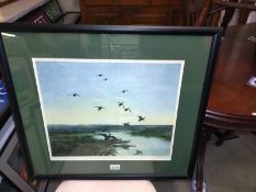 A framed and glazed signed Peter Scott print from fine art guild