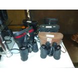 Five pairs of binoculars including Status 10X50, Boots Admiral, Solus 10X50.