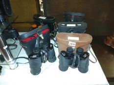 Five pairs of binoculars including Status 10X50, Boots Admiral, Solus 10X50.