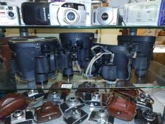 Five pairs on binoculars including Panorama 10X40, Frank Nipole 8X30, Bushnell 7X35, Kershaw 6X30,