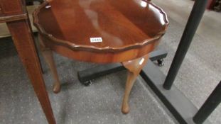 A 1930's dark wood coffee table on Queen Anne legs, 59 cm diameter, 23 cmc high, COLLECT ONLY.