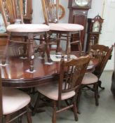 A dark wood dining table and a set of six dining chairs, COLLECT ONLY.