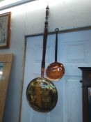 A Victorian copper and brass bed warming pan & a milk skimmer