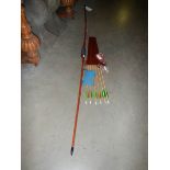 An English solid bamboo long bow, 30lb at 28" draw, with arrows, case, finger tab and arm protector.