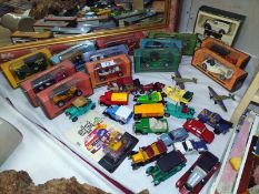 A quantity of boxed and loose diecast Matchbox models of yesteryear