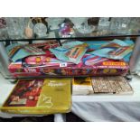 A selection of vintage games including Aladdin triples, Matchbox, Hi-speed loop catapult glider