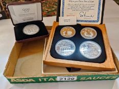 A cased 1976 Montreal Olympics silver proof set & Olympic Centennial coin 1896 - 1996 the