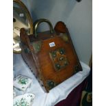 A Victorian/Edwardian mahogany coal box with brass embellishments