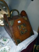 A Victorian/Edwardian mahogany coal box with brass embellishments