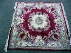 A middle Eastern style floral patterned rug. Length 250 cm x 240cm. COLLECT ONLY.