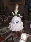 A Royal Worcester Debutante figurine.
