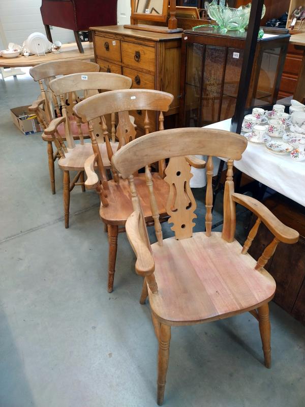 A set of four Beech Carver chairs. COLLECT ONLY.