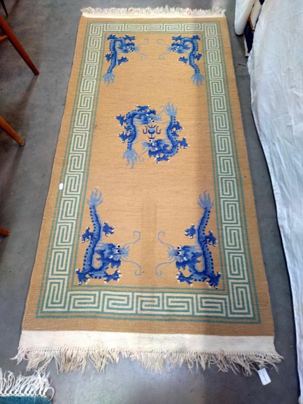 A beige and green rug with Blue dragon motifs. 172 cm x 78cm - Image 2 of 2