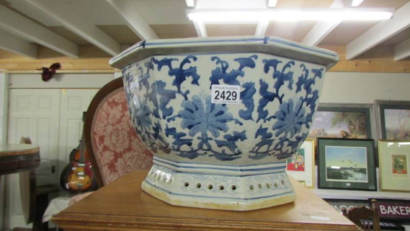 A large Chinese blue and white planter, 39.5 x 23.5 cm, 42 cm at widest point, COLLECT ONLY.