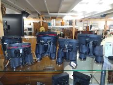 Five pairs of binoculars including Prinzlux 7X50, Pathescope 8X40, Philo 10X50, Rutland 8X40 and