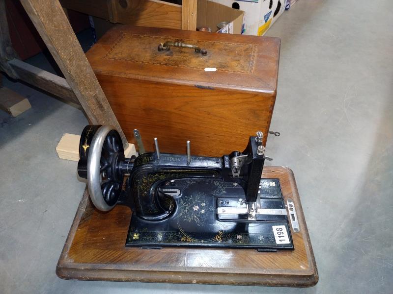 A vintage Frister Rossmann sewing machine in an inlaid box. COLLECT ONLY.