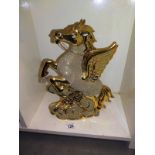 A large ornate gilded pottery winged rearing horse height 36cm, COLLECT ONLY.