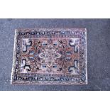 A middle Eastern style patterned rug. Length 105cm x 80cm. COLLECT ONLY.