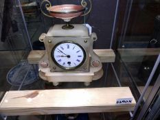 A 19th Century alabaster mantel clock, enamel dial, surmounted with an urn.