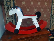 A vintage painted wooden rocking horse Length 85cm, height 56cm, seat height 38cm