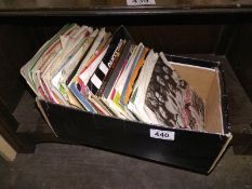 A collection of 45 RPM 12" singles including Rolling Stones etc.