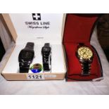 A boxed Swiss line wrist watch and Orlando watch.