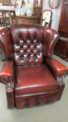 An oxblood deep buttoned leather arm chair. COLLECT ONLY,