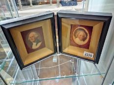 A pair of reproduction framed miniatures of George and Martha Washington. 18.5cm x 21cm x 4.5cm