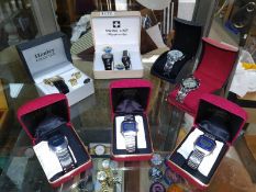 A quantity of boxed watches including Ingersoll digital watches.