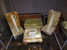 A pair of marble bookends and two trinket boxes